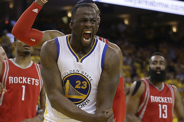 Golden State Warriors' Draymond Green (23) yells after being fouled by Houston Rockets' Dwight Howard during the second half in Game 2 of a first-round NBA basketball playoff series Monday, April 18, 2016, in Oakland, Calif. The Warriors won, 115-106. At left is Rockets' Trevor Ariza (1). (AP Photo/Ben Margot)