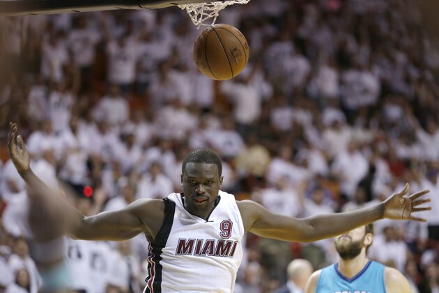 Miami Heat forward Luol Deng scores against the Charlotte Hornets during the second half of Game 2 of a first-round NBA basketball playoff series, Wednesday, April 20, 2016, in Miami. The Heat won 115-103. (AP Photo/Alan Diaz)