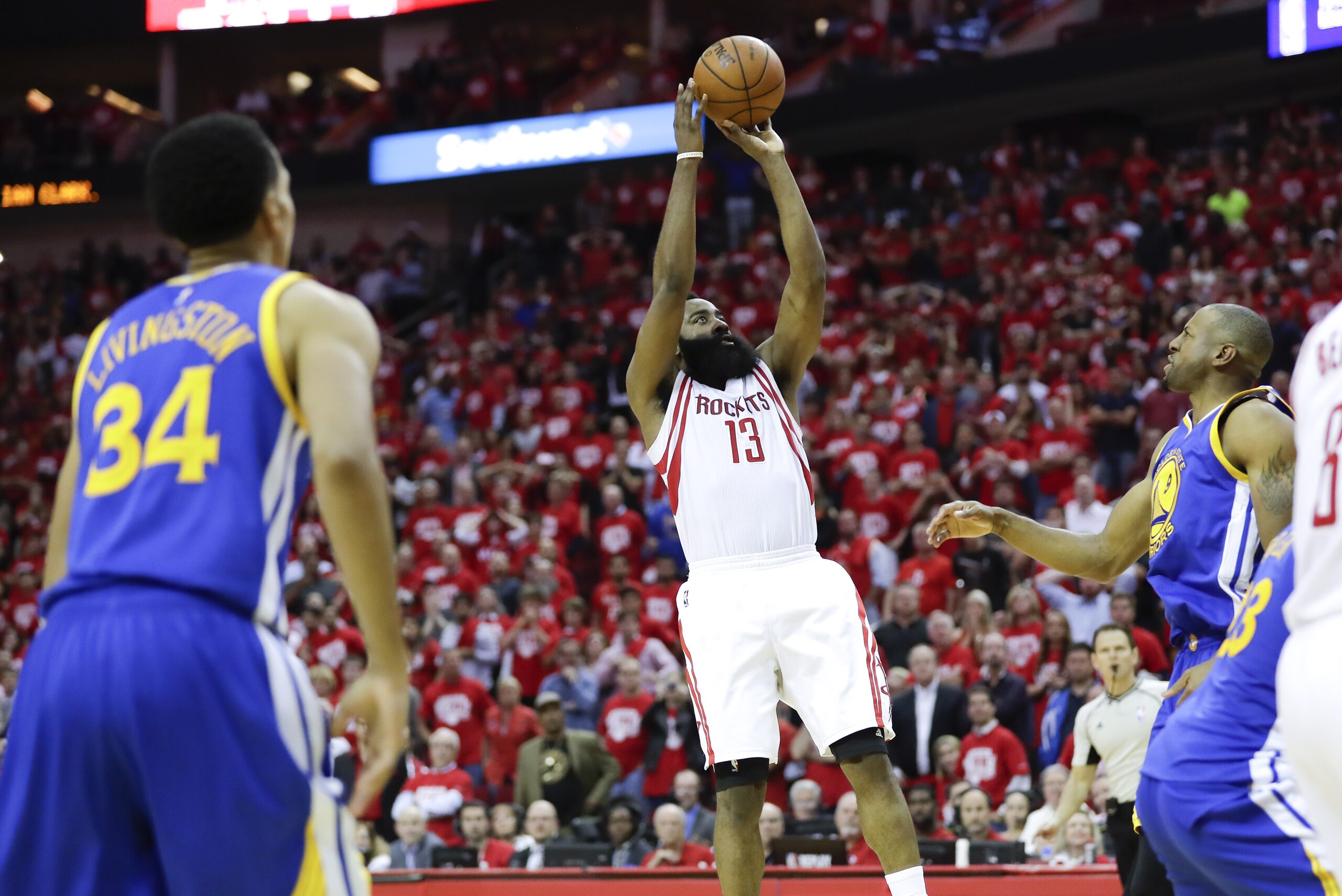 Houston Rockets guard James Harden scores the winning basket during the second half in Game 3 of a first-round NBA basketball playoff series against the Golden State Warriors, Thursday, April 21, 2016, in Houston. (AP Photo/David J. Phillip)