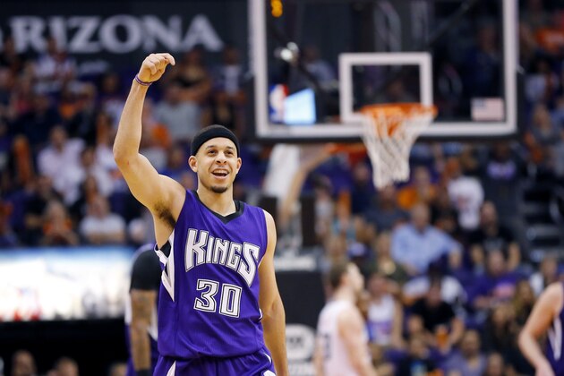 Sacramento Kings guard Seth Curry (30) celebrates his basket against the Phoenix Suns during the second half of an NBA basketball game, Monday, April 11, 2016, in Phoenix. (AP Photo/Matt York)
