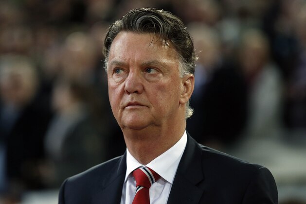 United’s manager Louis van Gaal concentrates prior to the English FA Cup quarterfinal replay soccer match between West Ham and Manchester United at Boleyn Ground stadium in London, Wednesday, April 13, 2016.(AP Photo/Alastair Grant)