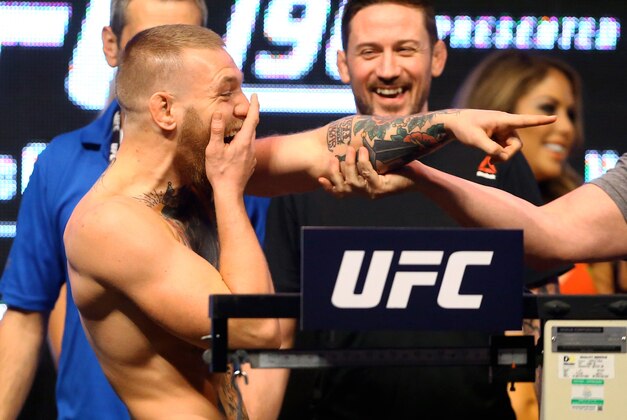 Mar 4, 2016; Las Vegas, NV, USA; Conor McGregor reacts as he taunts Nate Diaz (not pictured) during weigh-ins for UFC 196 at MGM Grand Garden Arena. Mandatory Credit: Mark J. Rebilas-USA TODAY Sports