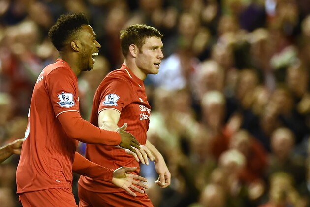 Liverpool's English striker Daniel Sturridge (L) celebrates with Liverpool's English midfielder James Milner after scoring during the English Premier League football match between Liverpool and Everton at Anfield in Liverpool, north west England on April 20, 2016. / AFP / PAUL ELLIS / RESTRICTED TO EDITORIAL USE. No use with unauthorized audio, video, data, fixture lists, club/league logos or 'live' services. Online in-match use limited to 75 images, no video emulation. No use in betting, games or single club/league/player publications.  /         (Photo credit should read PAUL ELLIS/AFP/Getty Images)