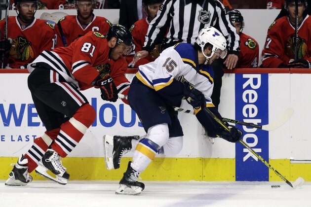 St. Louis Blues center Robby Fabbri, right, controls the puck past Chicago Blackhawks  right wing Marian Hossa during the first period in Game 4 of an NHL hockey first-round Stanley Cup playoff series Tuesday, April 19, 2016, in Chicago. (AP Photo/Nam Y. Huh)