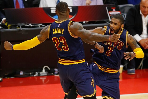 AUBURN HILLS, MI - April 22: Kyrie Irving #2 of the Cleveland Cavaliers celebrates his late fourth quarter three pointer with LeBron James #23 while playing the Detroit Pistons in game three of the NBA Eastern Conference quarterfinals at the Palace of Auburn Hills on April 22, 2016 in Auburn Hills, Michigan. NOTE TO USER: User expressly acknowledges and agrees that, by downloading and or using this photograph, User is consenting to the terms and conditions of the Getty Images License Agreement.  (Photo by Gregory Shamus/Getty Images)