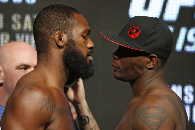 Jon Jones, left, and Ovince Saint Preux pose for photographers during a weigh-in for UFC 197, Friday, April 22, 2016, in Las Vegas. The two are scheduled to fight in an interim light heavyweight title bout Saturday in Las Vegas.(AP Photo/John Locher)