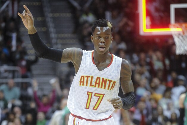 Atlanta Hawks guard Dennis Schroder, of Germany, reacts after sinking a jumper at the shot clock during the second half of an NBA basketball game against the Boston Celtics, Saturday, April 9, 2016, in Atlanta. Atlanta won 118-107. (AP Photo/John Amis)