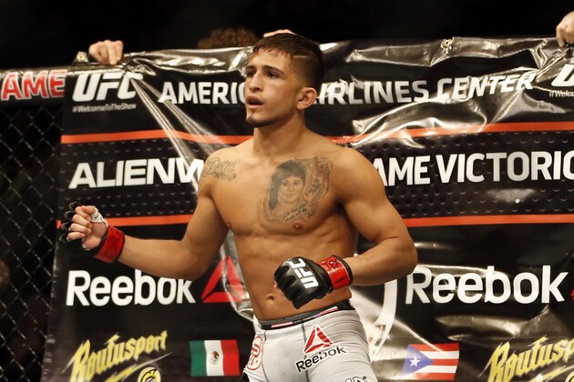 Mar 14, 2015; Dallas, TX, USA; Sergio Pettis (red) before fighing Ryan Benoit (blue) in the flyweight bout during UFC 185 at American Airlines Center. Mandatory Credit: Tim Heitman-USA TODAY Sports