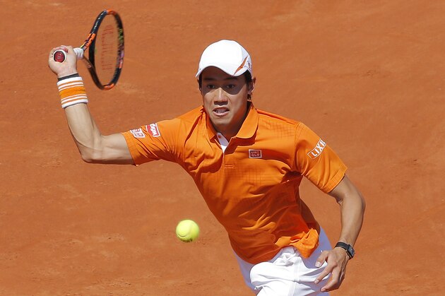 Kei Nishikori of Japan returns the ball to Benoit Paire of France, during the Barcelona open tennis tournament in Barcelona, Spain, Saturday, April 23, 2016. (AP Photo/Manu Fernandez)