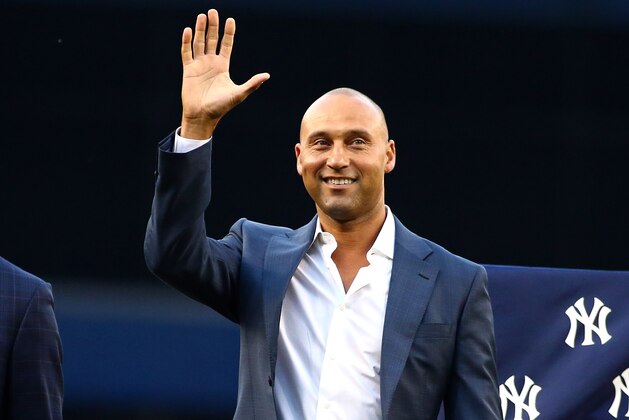 May 24, 2015; Bronx, NY, USA; New York Yankees former player Derek Jeter waves to the crowd during the ceremony retiring Bernie Williams number 51 prior to the game against the Texas Rangers at Yankee Stadium. Mandatory Credit: Andy Marlin-USA TODAY Sports