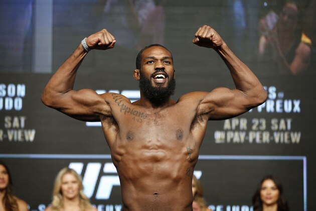 Jon Jones reacts on the scale during a weigh-in for UFC 197, Friday, April 22, 2016, in Las Vegas. Jones is scheduled to fight Ovince Saint Preux in an interim light heavyweight title bout Saturday in Las Vegas.(AP Photo/John Locher)