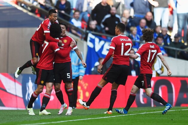 LONDON, ENGLAND - APRIL 23:  Marouane Fellaini of Manchester United celebrates with team mates after scoring the opening goal during The Emirates FA Cup semi final match between Everton and Manchester United at Wembley Stadium on April 23, 2016 in London, England.  (Photo by Mike Hewitt/Getty Images)