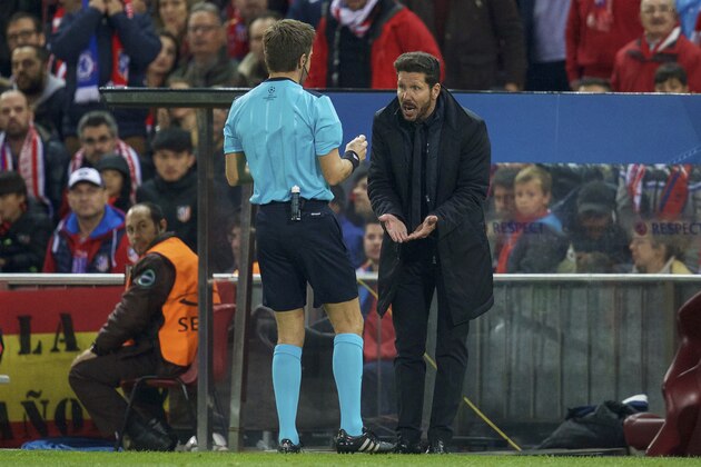 (L-R) referee Nicola Rizzoli, coach Diego Simeone of Club Atletico de Madrid during the UEFA Champions League quarter-final match between  Atletico Madrid and FC Barcelona on April 13, 2016 at the Vicente Calderon stadium in Madrid, Spain.(Photo by VI Images via Getty Images)