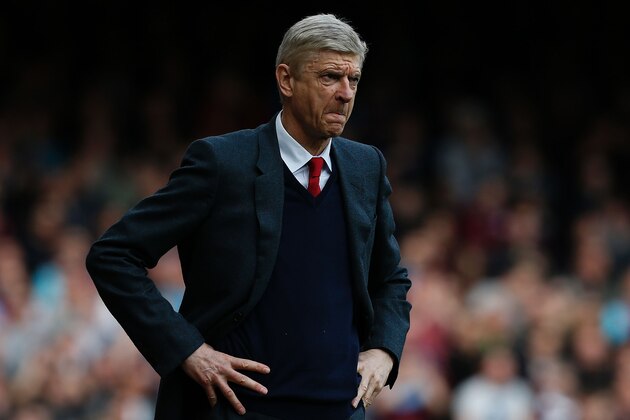 Arsenal's French manager Arsene Wenger reacts during the English Premier League football match between West Ham United and Arsenal at The Boleyn Ground in Upton Park, in east London on April 9, 2016.The match ended 3-3. / AFP / Ian Kington / RESTRICTED TO EDITORIAL USE. No use with unauthorized audio, video, data, fixture lists, club/league logos or 'live' services. Online in-match use limited to 75 images, no video emulation. No use in betting, games or single club/league/player publications.  /         (Photo credit should read IAN KINGTON/AFP/Getty Images)