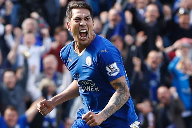Leicester City's Argentinian striker Leonardo Ulloa celebrates after scoring their second goal from the penalty spot to equalise 2-2 as West Ham United's Spanish goalkeeper Adrian (R) reacts during the English Premier League football match between Leicester City and West Ham United at King Power Stadium in Leicester, central England on April 17, 2016. / AFP / ADRIAN DENNIS / RESTRICTED TO EDITORIAL USE. No use with unauthorized audio, video, data, fixture lists, club/league logos or 'live' services. Online in-match use limited to 75 images, no video emulation. No use in betting, games or single club/league/player publications.  /         (Photo credit should read ADRIAN DENNIS/AFP/Getty Images)