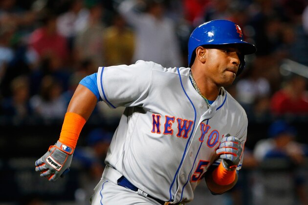 ATLANTA, GA - APRIL 22:  Yoenis Cespedes #52 of the New York Mets rounds first base on the way to a double he hit in the eighth inning against the Atlanta Braves at Turner Field on April 22, 2016 in Atlanta, Georgia.  (Photo by Kevin C. Cox/Getty Images)