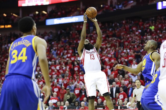 Houston Rockets guard James Harden scores the winning basket during the second half in Game 3 of a first-round NBA basketball playoff series against the Golden State Warriors, Thursday, April 21, 2016, in Houston. (AP Photo/David J. Phillip)