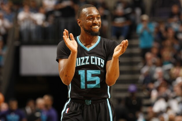 CHARLOTTE, NC  - APRIL 23: Kemba Walker #15 of the Charlotte Hornets reacts after a play against the Miami Heat during Game Three of the Eastern Conference Quarterfinals during the 2016 NBA Playoffs on April 23, 2016 at Time Warner Cable Arena in Charlotte, North Carolina. NOTE TO USER: User expressly acknowledges and agrees that, by downloading and or using this Photograph, user is consenting to the terms and conditions of the Getty Images License Agreement. Mandatory Copyright Notice: Copyright 2016 NBAE (Photo by Kent Smith/NBAE via Getty Images)