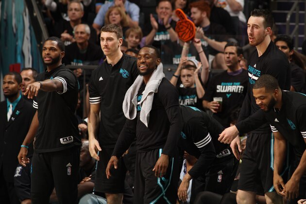 CHARLOTTE, NC  - APRIL 23: The Charlotte Hornets cheer from the bench against the Miami Heat during Game Three of the Eastern Conference Quarterfinals during the 2016 NBA Playoffs on April 23, 2016 at Time Warner Cable Arena in Charlotte, North Carolina. NOTE TO USER: User expressly acknowledges and agrees that, by downloading and or using this Photograph, user is consenting to the terms and conditions of the Getty Images License Agreement. Mandatory Copyright Notice: Copyright 2016 NBAE (Photo by Brock Williams-Smith/NBAE via Getty Images)