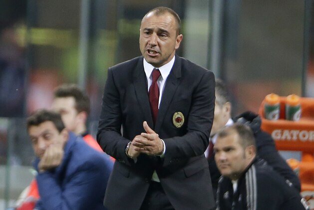 AC Milan coach Cristian Brocchi gives instructions during the Serie A soccer match between AC Milan and Carpi at the San Siro stadium in Milan, Italy, Thursday, April 21, 2016. (AP Photo/Antonio Calanni)