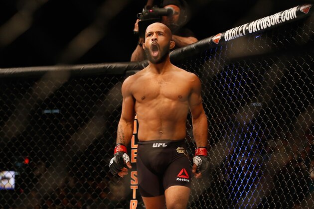 LAS VEGAS, NV - APRIL 23:  Demetrious Johnson celebrates his TKO victory over Henry Cejudo in their flyweight championship bout during the UFC 197 event inside MGM Grand Garden Arena on April 23, 2016 in Las Vegas, Nevada.  (Photo by Christian Petersen/Zuffa LLC/Zuffa LLC via Getty Images)