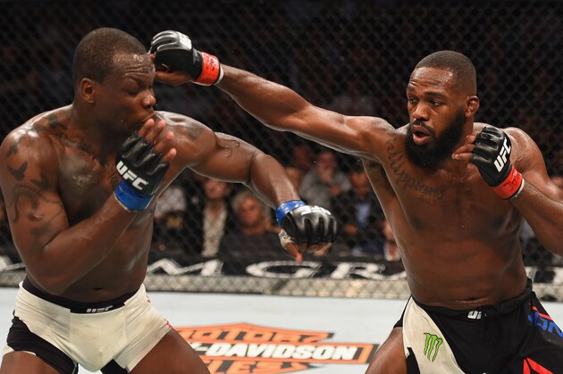 LAS VEGAS, NV - APRIL 23:  (R-L) Jon Jones punches Ovince Saint Preux in their interim UFC light heavyweight championship bout during the UFC 197 event inside MGM Grand Garden Arena on April 23, 2016 in Las Vegas, Nevada.  (Photo by Josh Hedges/Zuffa LLC/Zuffa LLC via Getty Images)