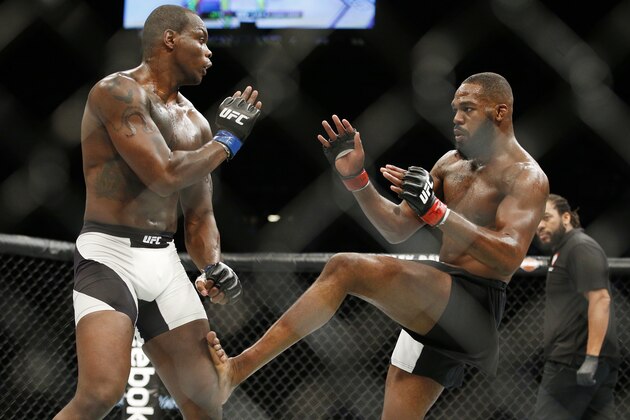 Jon Jones kicks Ovince Saint Preux during an interim light heavyweight championship mixed martial arts bout at UFC 197, Saturday, April 23, 2016, in Las Vegas. (AP Photo/John Locher)