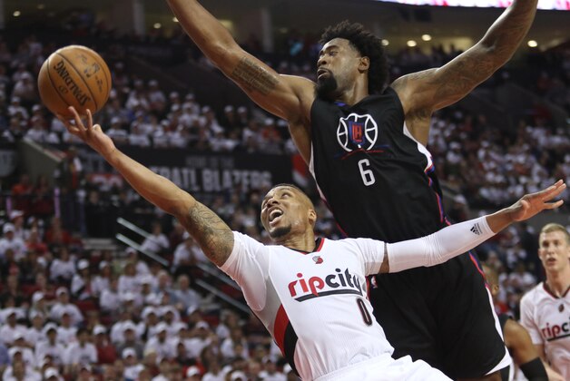Apr 23, 2016; Portland, OR, USA; Portland Trail Blazers guard Damian Lillard (0) shoots against Los Angeles Clippers center DeAndre Jordan (6) in game three of the first round of the NBA Playoffs at Moda Center at the Rose Quarter. Mandatory Credit: Jaime Valdez-USA TODAY Sports