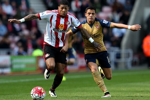 SUNDERLAND, ENGLAND - APRIL 24:  Patrick van Aanholt of Sunderland and Alexis Sanchez of Arsenal battle for the ball during the Barclays Premier League match between Sunderland and Arsenal at the Stadium of Light on April 24, 2016 in Sunderland, United Kingdom.  (Photo by Jan Kruger/Getty Images)