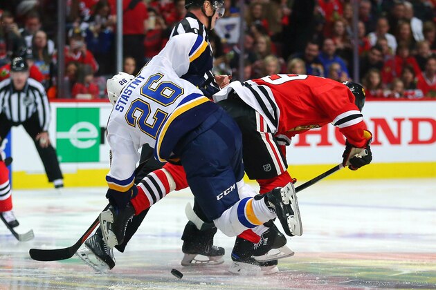 Apr 23, 2016; Chicago, IL, USA; St. Louis Blues center Paul Stastny (26) and Chicago Blackhawks center Jonathan Toews (19) fight for a face off during the first period in game six of the first round of the 2016 Stanley Cup Playoffs at the United Center. Mandatory Credit: Dennis Wierzbicki-USA TODAY Sports