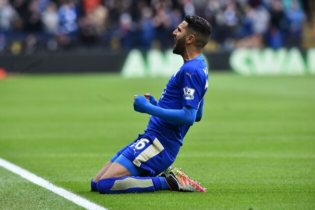 Leicester City's Algerian midfielder Riyad Mahrez celebrates scoring the opening goal during the English Premier League football match between Leicester City and Swansea at King Power Stadium in Leicester, central England on April 24, 2016. / AFP / BEN STANSALL / RESTRICTED TO EDITORIAL USE. No use with unauthorized audio, video, data, fixture lists, club/league logos or 'live' services. Online in-match use limited to 75 images, no video emulation. No use in betting, games or single club/league/player publications.  /         (Photo credit should read BEN STANSALL/AFP/Getty Images)
