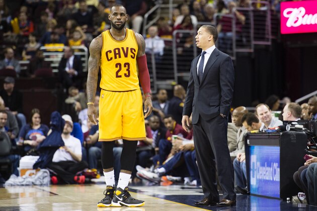 CLEVELAND, OH - MARCH 31: LeBron James #23 of the Cleveland Cavaliers talks to head coach Tyronn Lue during the first half against the Brooklyn Nets at Quicken Loans Arena on March 31, 2016 in Cleveland, Ohio. NOTE TO USER: User expressly acknowledges and agrees that, by downloading and/or using this photograph, user is consenting to the terms and conditions of the Getty Images License Agreement. Mandatory copyright notice. (Photo by Jason Miller/Getty Images)