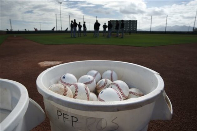 FILE- This Feb. 22, 2015, file photo shows buckets of balls at a Cleveland Indians spring training baseball workout in Goodyear, Ariz. Major League Baseball changed how balls are handled before games this season, adding an extra layer of security in the wake of the Tom Brady flap. (AP Photo/John Locher, File)