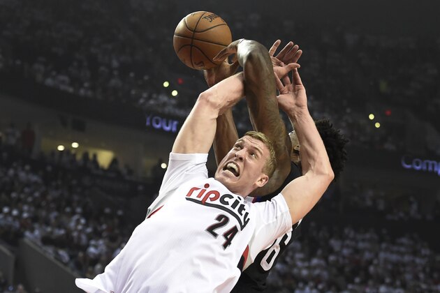 PORTLAND, OR - APRIL 23: Mason Plumlee #24 of the Portland Trail Blazers gets tangled up with DeAndre Jordan #6 of the Los Angeles Clippers as they go for a rebound in the first quarter of Game Three of the Western Conference Quarterfinals during the 2016 NBA Playoffs at the Moda Center on April 23, 2016 in Portland, Oregon. NOTE TO USER: User expressly acknowledges and agrees that by downloading and/or using this photograph, user is consenting to the terms and conditions of the Getty Images License Agreement.  (Photo by Steve Dykes/Getty Images)