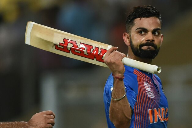India's Virat Kohli walks off the pitch after the conclusion of their team innings during the World T20 semi-final match between India and West Indies at The Wankhede Cricket Stadium in Mumbai on March 31, 2016.
India's dreams of a World Twenty20 title on home soil were shattered on Thursday after the West Indies stunned the hosts by seven wickets to reach the final. / AFP / INDRANIL MUKHERJEE        (Photo credit should read INDRANIL MUKHERJEE/AFP/Getty Images)