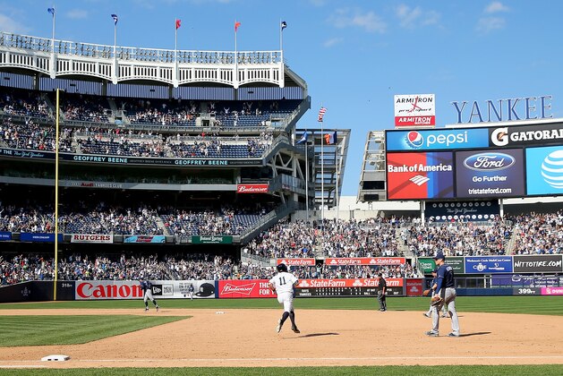 NEW YORK, NY - APRIL 23:  Brett Gardner #11 of the New York Yankees rounds first base after he hit a solo home run in the bottom of the ninth inning to win the game against the Tampa Bay Rays at Yankee Stadium on April 23, 2016 in the Bronx borough of New York City.The New York Yankees defeated the Tampa Bay Rays 3-2.  (Photo by Elsa/Getty Images)