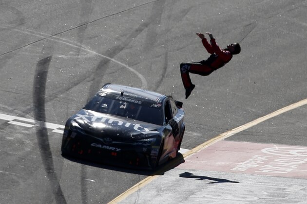 RICHMOND, VA - APRIL 24:  Carl Edwards, driver of the #19 XFINITY Toyota, celebrates with a backflip after winning the NASCAR Sprint Cup Series TOYOTA OWNERS 400 at Richmond International Raceway on April 24, 2016 in Richmond, Virginia.  (Photo by Todd Warshaw/Getty Images)