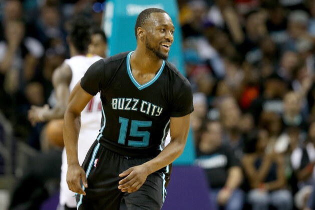 CHARLOTTE, NC - APRIL 23:  Kemba Walker #15 of the Charlotte Hornets reacts after a play against the Miami Heat during game three of the Eastern Conference Quarterfinals of the 2016 NBA Playoffs at Time Warner Cable Arena on April 23, 2016 in Charlotte, North Carolina.  NOTE TO USER: User expressly acknowledges and agrees that, by downloading and or using this photograph, User is consenting to the terms and conditions of the Getty Images License Agreement.  (Photo by Streeter Lecka/Getty Images)