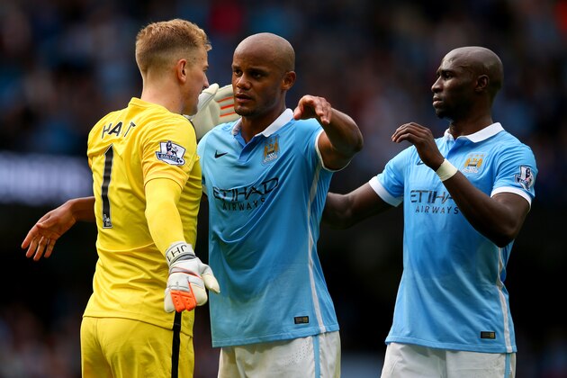 MANCHESTER, ENGLAND - AUGUST 29: (L to R) Joe Hart, Vincent Kompany and Eliaquim Mangala of Manchester City celebrate their team's 2-0 win in the Barclays Premier League match between Manchester City and Watford at Etihad Stadium on August 29, 2015 in Manchester, England.  (Photo by Alex Livesey/Getty Images)