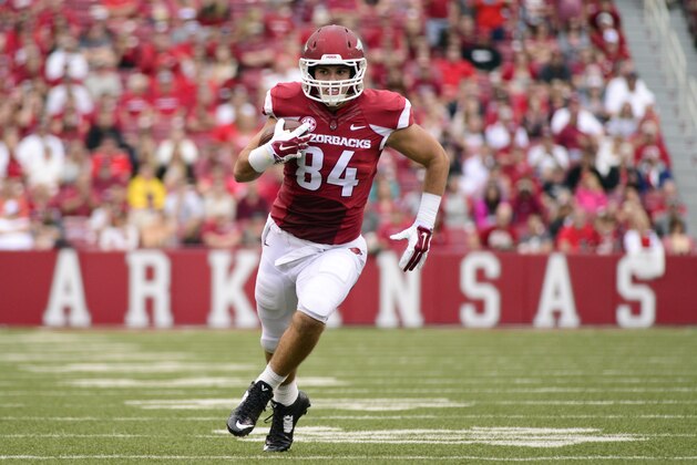 Arkansas tight end Hunter Henry carries in the first half of an NCAA college football game in Fayetteville, Ark., Friday, Sept. 6, 2014. (AP Photo/Sarah Bentham)