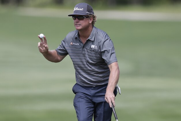 Charley Hoffman reacts to the gallery after making a birdie putt on the 14th hole during the final round of the Texas Open golf tournament, Sunday, April 24, 2016, in San Antonio. (AP Photo/Eric Gay)