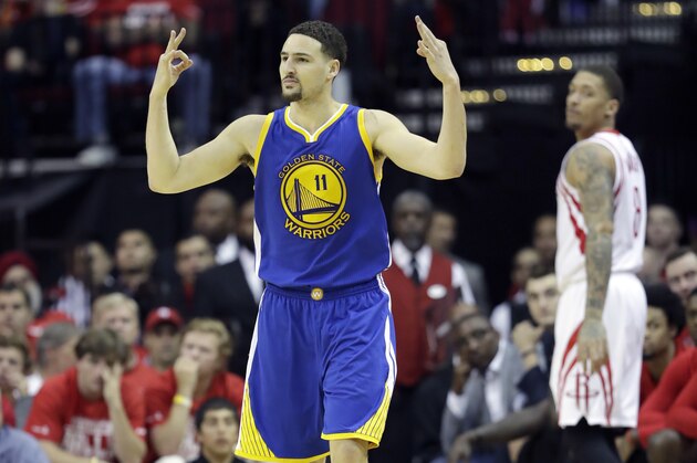 Golden State Warriors' Klay Thompson celebrates after hitting a 3-point basket during the second half in Game 4 of a first-round NBA basketball playoff series against the Houston Rockets, Sunday, April 24, 2016, in Houston. (AP Photo/David J. Phillip)