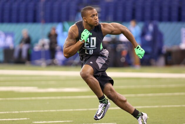 Ohio State linebacker Darron Lee  performs a drill at the NFL football scouting combine Sunday, Feb. 28, 2016, in Indianapolis. (AP Photo/Gregory Payan)