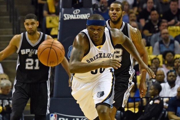 MEMPHIS, TN - APRIL 24:  Tim Duncan #21 ans LaMarcus Aldridge #12 of the San Antonio Spurs watch Zach Randolph #50 of the Memphis Grizzlies chase a loose ball during the first half of Game Four of the First Round of the NBA Playoffs at FedExForum on April 24, 2016 in Memphis, Tennessee. NOTE TO USER: User expressly acknowledges and agrees that, by downloading and or using this photograph, User is consenting to the terms and conditions of the Getty Images License Agreement.  (Photo by Frederick Breedon/Getty Images)