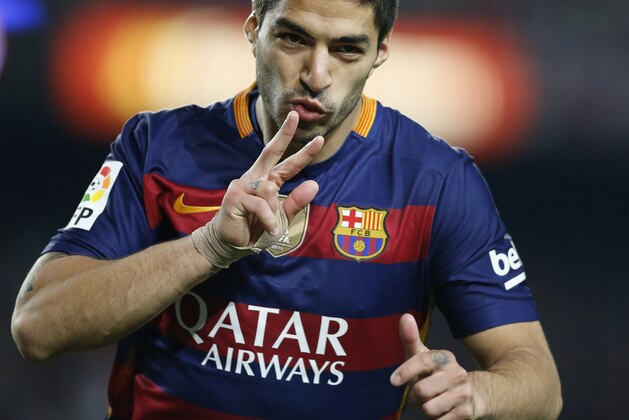FC Barcelona's Lus Suarez celebrates after scoring against Sporting Gijon during a Spanish La Liga soccer match at the Camp Nou stadium in Barcelona, Spain, Saturday, April 23, 2016. (AP Photo/Manu Fernandez)
