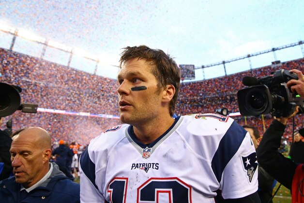 Jan 24, 2016; Denver, CO, USA; New England Patriots quarterback Tom Brady (12) reacts as he leaves the field following the game against the Denver Broncos in the AFC Championship football game at Sports Authority Field at Mile High. Mandatory Credit: Mark J. Rebilas-USA TODAY Sports