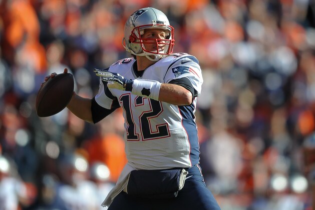 DENVER, CO - JANUARY 24:  Tom Brady #12 of the New England Patriots passes against the Denver Broncos  in the AFC Championship game at Sports Authority Field at Mile High on January 24, 2016 in Denver, Colorado.  (Photo by Dustin Bradford/Getty Images)