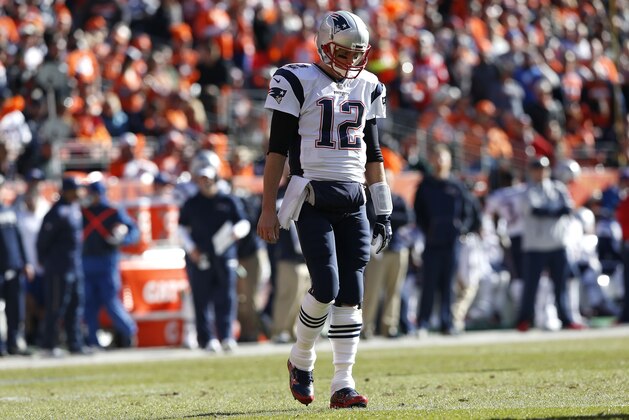 New England Patriots quarterback Tom Brady walks off the field during the first half the NFL football AFC Championship game between the Denver Broncos and the New England Patriots, Sunday, Jan. 24, 2016, in Denver. (AP Photo/David Zalubowski)