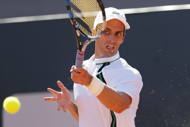 Albert Ramos-Vinolas of Spain returns the ball to David Ferrer of Spain at the Rio Open tennis tournament in Rio de Janeiro, Brazil, Thursday, Feb. 18, 2016. (AP Photo/Silvia Izquierdo)