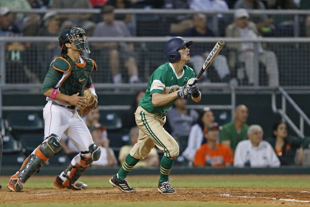 CORAL GABLES, FL - April 21: Cavan Biggio #23 of the Notre Dame Fighting Irish hits the ball against the Miami Hurricanes in the fourth inning on April 21, 2014 at Alex Rodriguez Park at Mark Light Field in Coral Gables, Florida. Miami defeated Notre Dame 6-3. (Photo by Joel Auerbach/Getty Images)